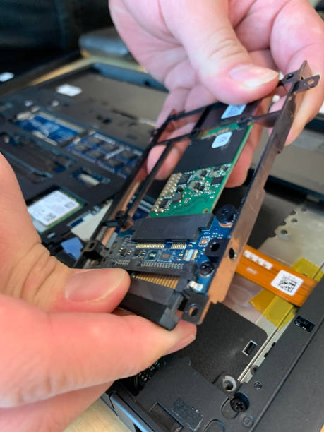 istock Cropped Hand Repairing Computer Motherboard 1284370135