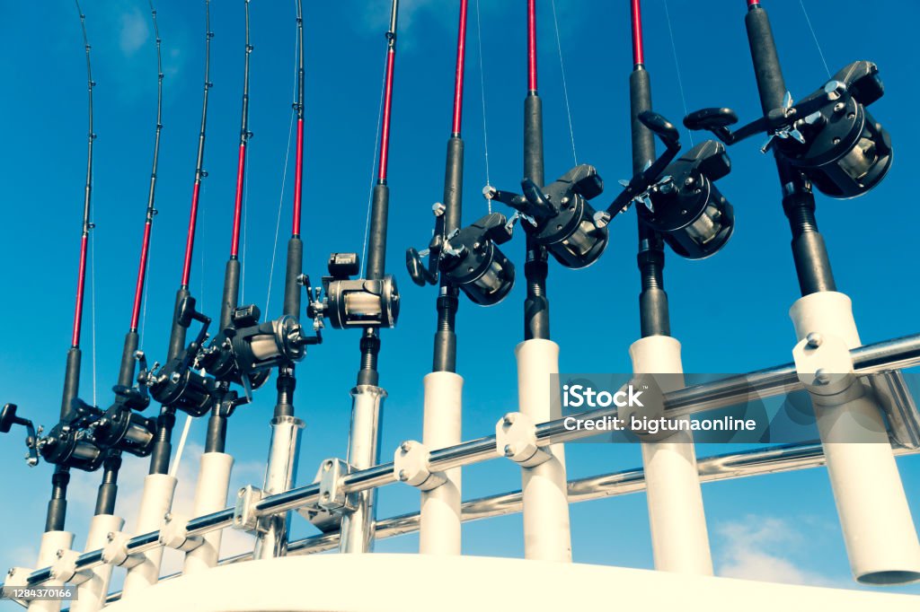 Fishing Trolling Boat Rods In Rod Holder Big Game Fishing Fishing Reels And  Rods Pattern On Boat Sea Fishing Rods And Reels In A Row Stock Photo -  Download Image Now - iStock