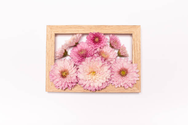 istock Creative layout flowers and wooden frame. Spring minimal concept. Nature background. 1284373770