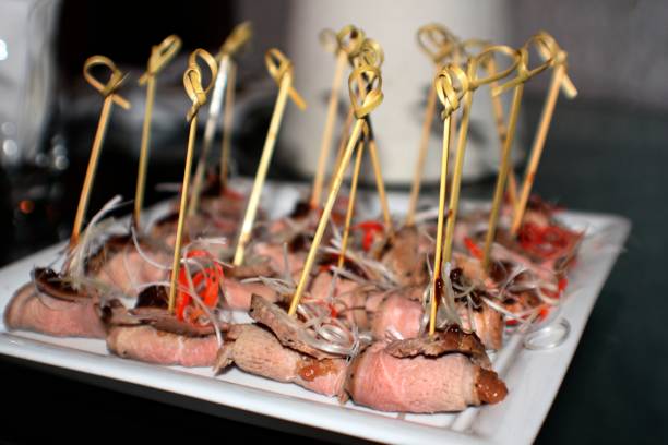 istock Rolled ham slices with fillings on sticks 1284376742