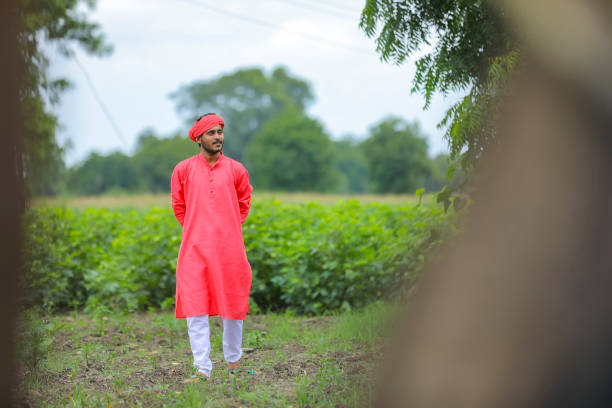 istock young indian farmer walking and observation in his field 1284381093