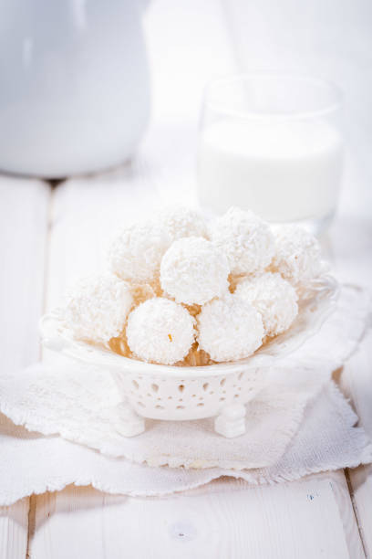 Coconut Sweet Laddoo OR Nariyal Ladduis a Popular Festival food from India. Served over moody background, selective focus