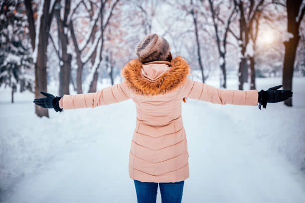 istock Joyful woman enjoys cold winter day 1284385776