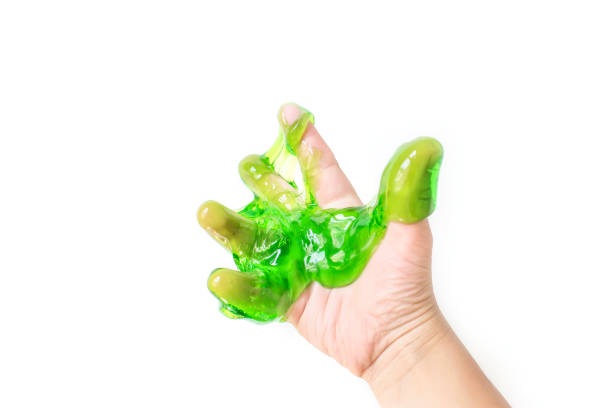 istock Toy called Slime. Mucus in children hand on a white background. Selective focus. 1284385943