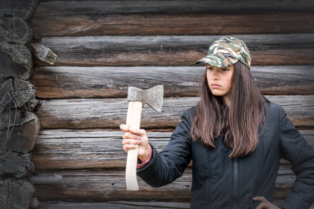istock Girl looking at axe outdoor 1284387058