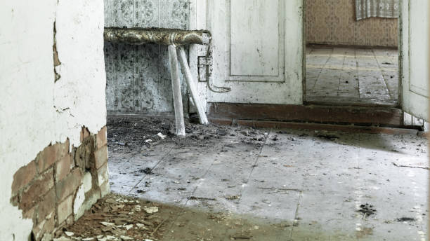 istock abandoned village room with dirty floor and old cement wall 1284387066