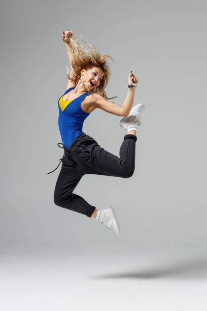 istock Hip hop dancer moving and jumping in photostudio 1284387536