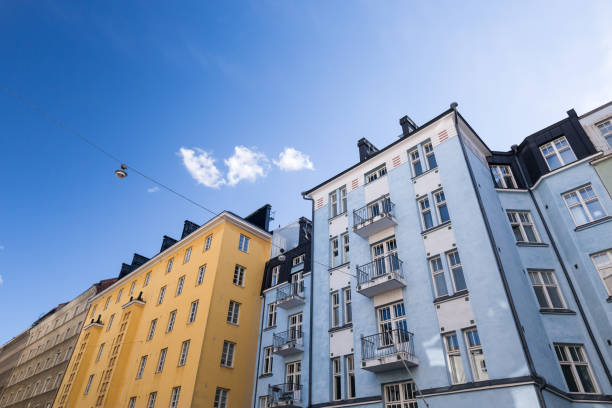 Building walls with windows on blue sky background. Outside