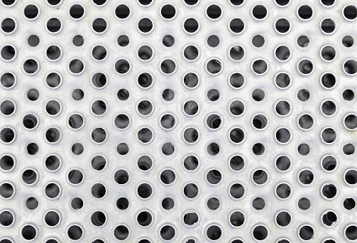 Metal plate with holes, detail of a steel plate with ciruclos, strength and hardness, iron
