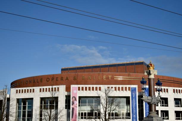 modern buildings for art November 2020 - Amsterdam / Netherlands : National Opera and Ballet building by the river in Amsterdam stopera stock pictures, royalty-free photos & images