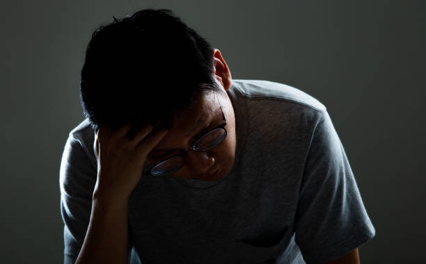 istock Sad and depressed man thinking of his problem - Feeling depressed background concept 1284393217