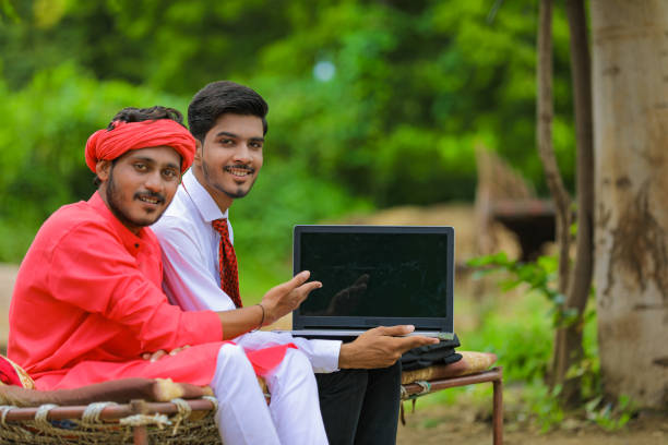 young indian farmer and agronomist or banker discuss at home - child office chaos computer monitor imagens e fotografias de stock