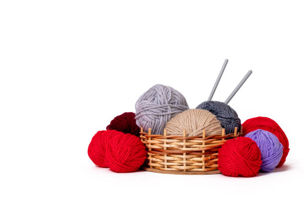 istock colored wool clews with needles in wicker basket 1284395350