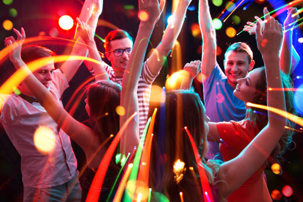 istock Group of young people having fun dancing at party. 1284397389