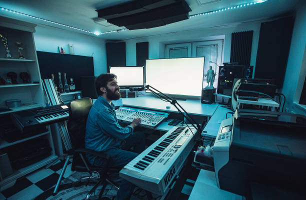 istock Male sound engineer working on mixing panel in recording studio 1284399259