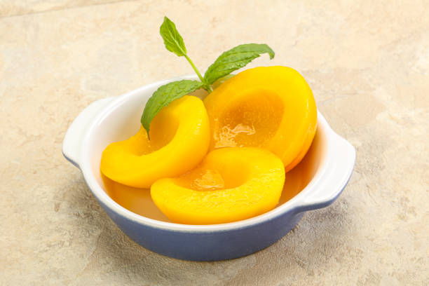 istock Sweet ripe canned peaches with mint 1284399568