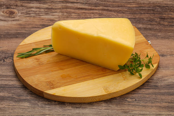 istock Hard cheese piece served rosemary 1284399617