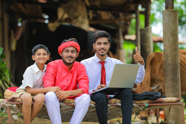 young indian farmer and agronomist or banker discuss at home - child office chaos computer monitor imagens e fotografias de stock