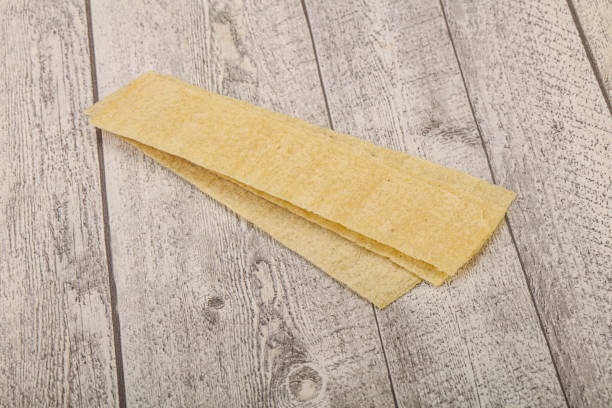 istock Natural salted potato chips heap 1284399926
