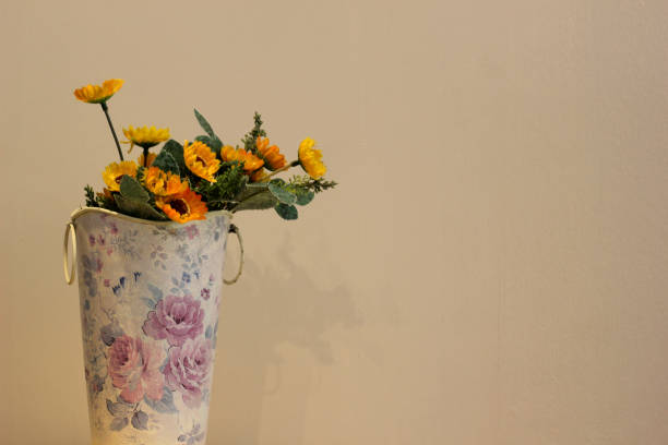 Yellow Flowers in a White-Purple Pot\nthis album about yellow flowers