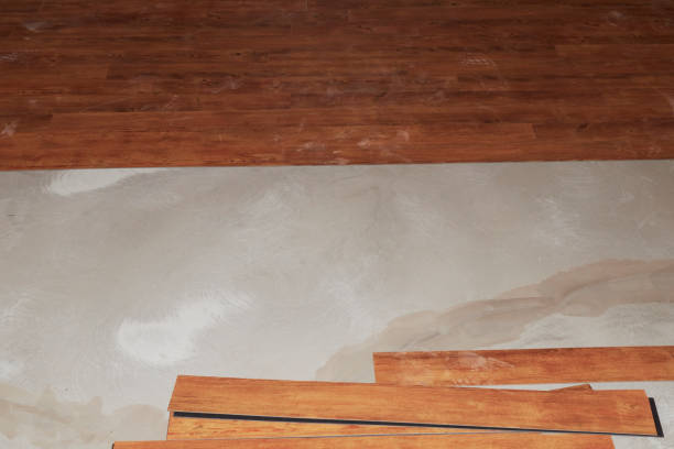 istock Vinyl floor with wood grain when laying on the floor. 1284402508