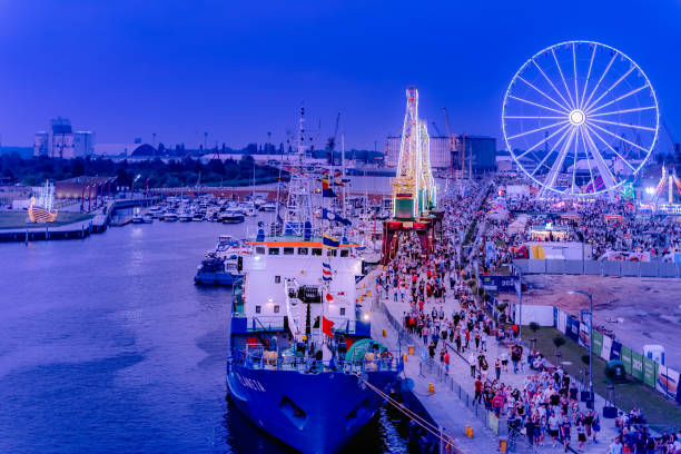 Szczecin, Poland, June 2019 Cranes called Dzwigozaury, amusement park at Odra River Boulevards. Crowds of tourists enjoying Days of the Sea festival