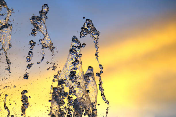 istock drops of the fountain in the setting sun sky 1284406503