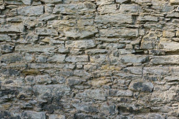 istock Fragment of a gray stone wall. 1284409385