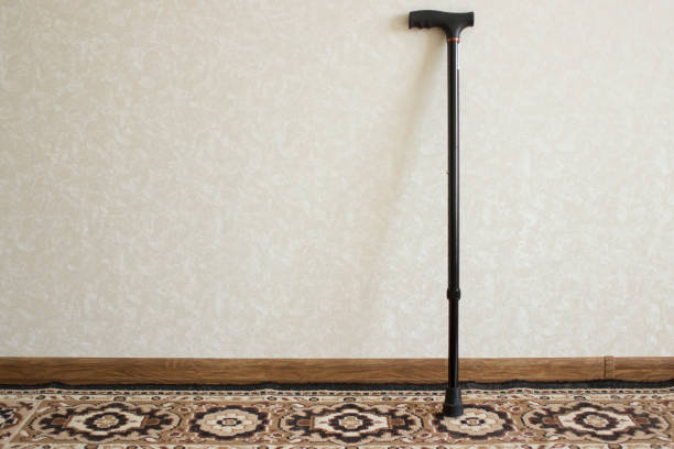 istock A black metal cane stands near the wall. 1284411211