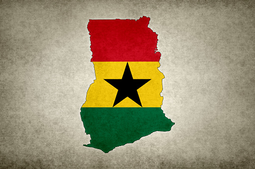 Grunge map of Ghana with its flag printed within its border on an old paper.