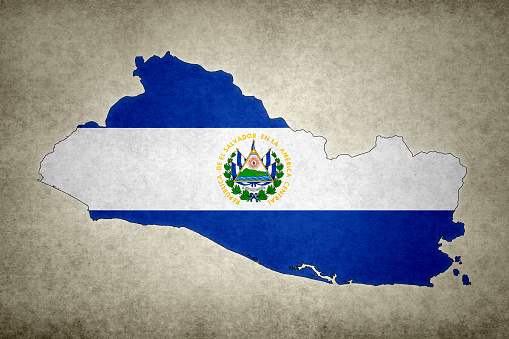 Grunge map of El Salvador with its flag printed within its border on an old paper.