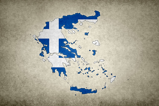 Grunge map of Greece with its flag printed within its border on an old paper.