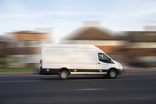 White Van transport in motion in United Kingdom