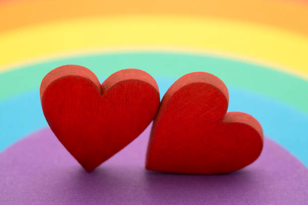 istock Two hearts on a colorful rainbow background 1284420884