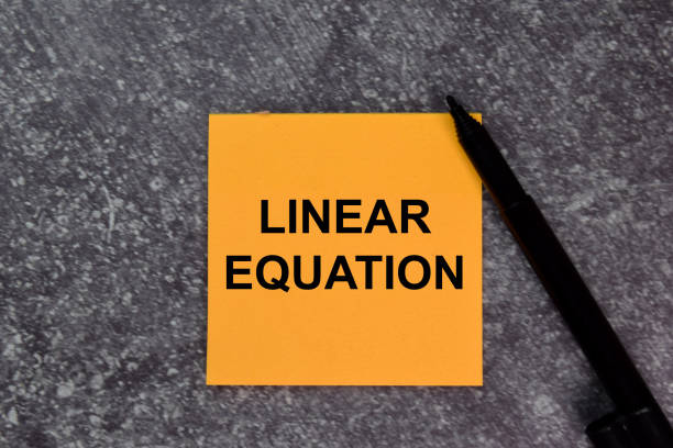 istock Linear Equation on top view isolated on office desk. 1284421998
