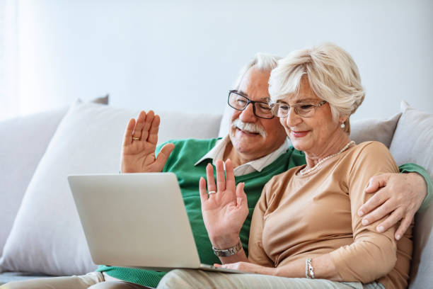 istock Happy elderly couple having a video call looking involved. 1284423157