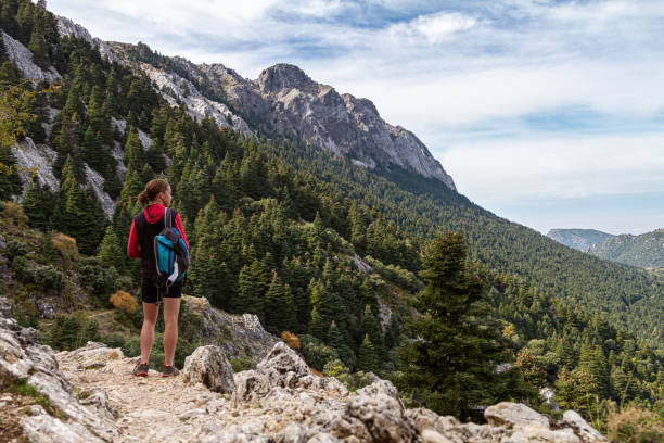 istock A young woman hiking 1284423472