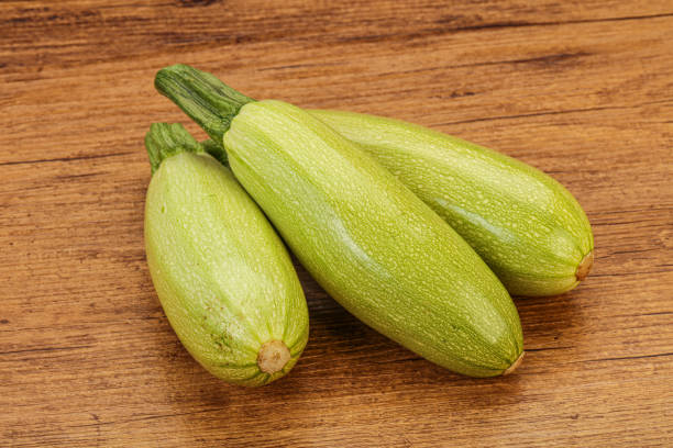istock Young tasty zucchini over board 1284423577