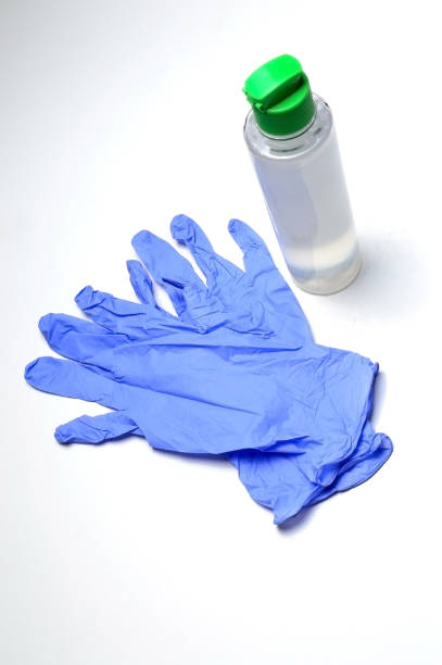 istock medical gloves and jar with sanitizer. 1284424766