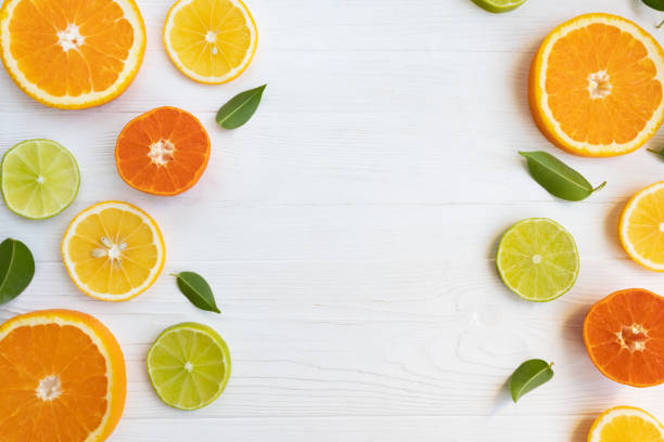 istock Lemons, lime, orange and grapefruit and tangerines cut into circles on a white background with space for text. Poster, banner, article. 1284425070