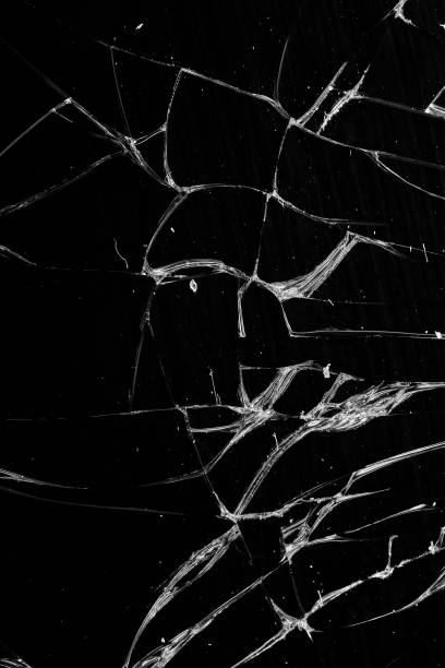 istock Broken glass - white lines on black background, design element. touch screen smartphone with broken screen 1284427506