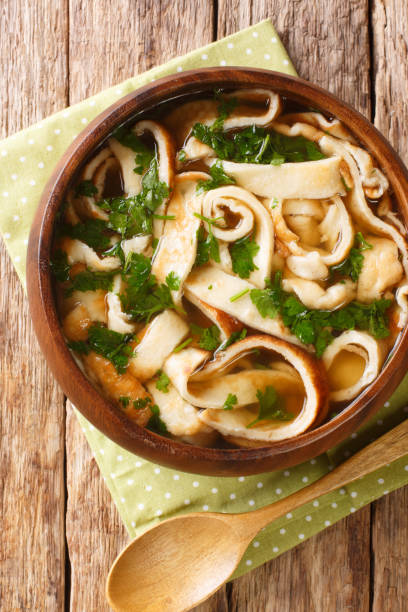 istock Frittatensuppe sliced pancake soup close-up in a plate. vertical top view 1284428623