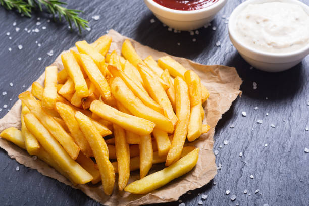 istock French fries with rosemary and ketchup 1284429694