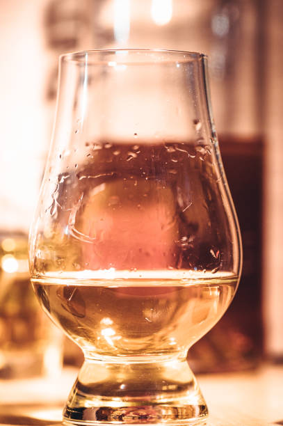 istock Selective focus glasses of whiskey on rustic wood background 1284431122