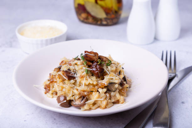 Risotto with porcini mushrooms. A traditional Italian dish. Risotto with porcini mushrooms. A traditional Italian dish. Close-up, horizontal orientation. Cepe stock pictures, royalty-free photos & images