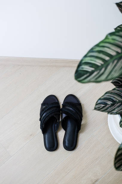 istock Woman's black elegant sandals minimalism concept 1284435747