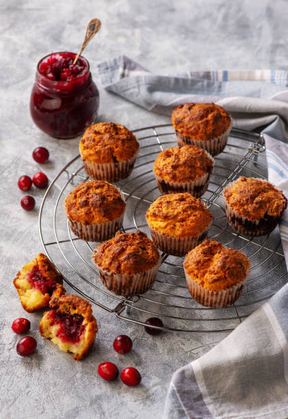 istock Homemade muffins with cranberry filling, on light background. 1284435766
