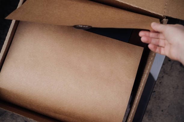 istock Brown open box with craft wrapping paper 1284435828