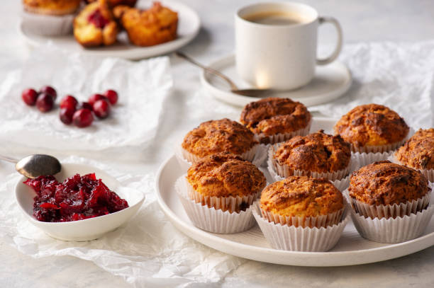 istock Homemade muffins with cranberry filling, on light background. 1284437701