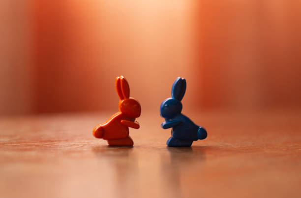 istock Figures of hares, symbolizing acquaintance 1284438012